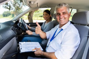 a trainer in a car with pupil running an advanced driving course Defensive Driver Training One Day Course